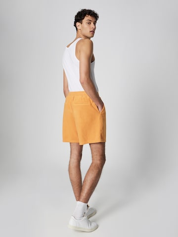 ABOUT YOU x Jaime Lorente Regular Shorts 'Leon' in Orange