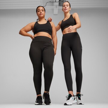 Skinny Pantaloni sport de la PUMA pe negru: față