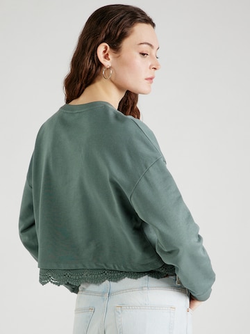 ABOUT YOU Sweatshirt 'Georgeia' in Groen
