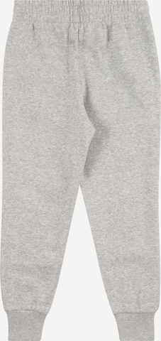 Effilé Pantalon de sport 'Rival' UNDER ARMOUR en gris