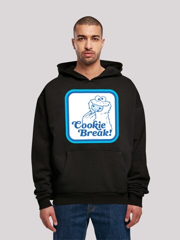 F4NT4STIC Sweatshirt 'Sesame Street Cookie Bracke' in Zwart: voorkant