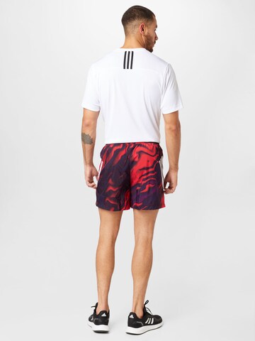 ADIDAS SPORTSWEAR regular Παντελόνι φόρμας 'Future Icons Allover Print' σε κόκκινο