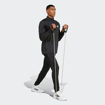 ADIDAS PERFORMANCE Tapered Sports trousers 'Essentials Camo' in Black