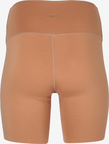 Athlecia Skinny Workout Pants 'Almy' in Orange