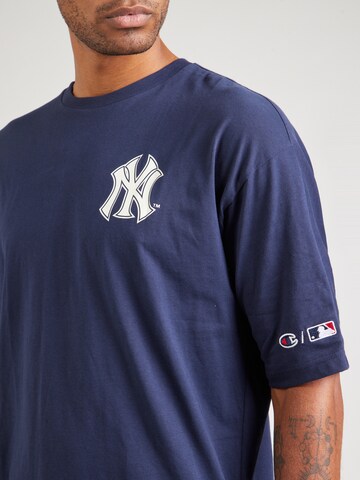 Champion Authentic Athletic Apparel - Camisa em azul