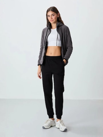 Tommy Life Sports trousers 'Jogginghose' in Black: front