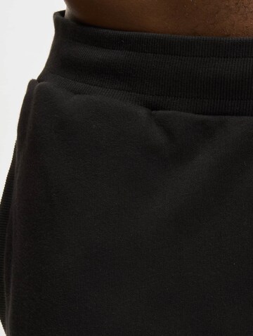Urban Classics Regular Trousers 'Dangerous' in Black