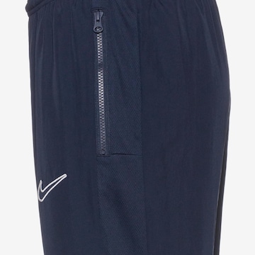 NIKETapered Sportske hlače 'Academy23' - plava boja