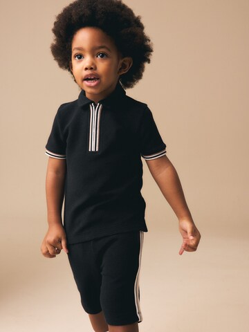 Next - Conjunto en negro: frente