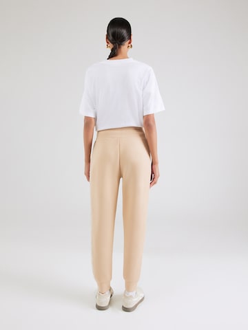 Tapered Pantaloni di GUESS in beige