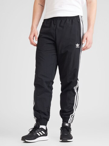 ADIDAS ORIGINALS Tapered Trousers in Black: front