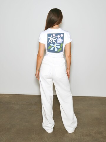 florence by mills exclusive for ABOUT YOU Wide leg Trousers 'Poinsettia' in White