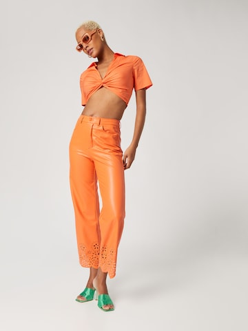 Katy Perry exclusive for ABOUT YOU Flared Pants 'Nala' in Orange