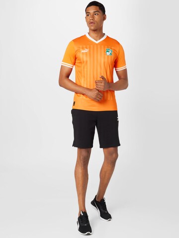 PUMA - Camiseta de fútbol en naranja