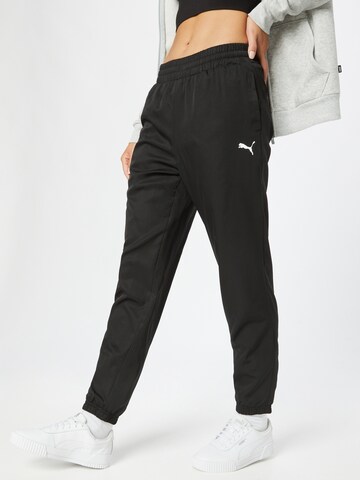 PUMA Tapered Sports trousers in Black: front