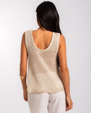 Top in maglia di THE-ARE in oro