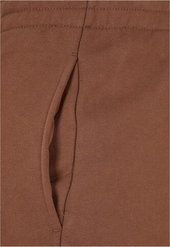 Tapered Pantaloni di Urban Classics in marrone