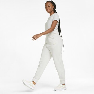 Tapered Pantaloni sportivi di PUMA in bianco