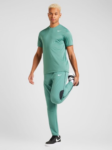 NIKE Ohlapna forma Športne hlače 'Advantage' | zelena barva