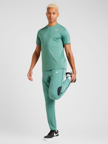 Loosefit Pantalon de sport 'Advantage' NIKE en vert