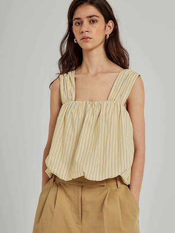 Top di NORR in giallo: frontale