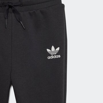 ADIDAS ORIGINALS Träningsoverall 'Rekive' i svart