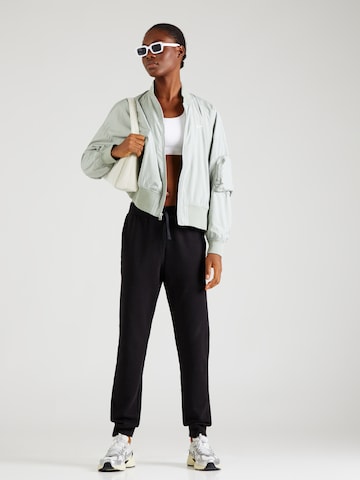 Champion Authentic Athletic Apparel - Tapered Pantalón en negro