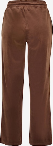 Karl Kani Lużny krój Spodnie w kolorze brązowy