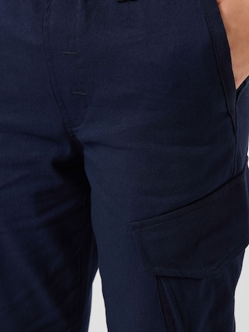 Pantalon 'TOMMY Kinder Cargo-Joggerhose' Tommy Life en bleu