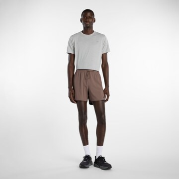 new balance Loosefit Sportbroek 'Essential' in Bruin