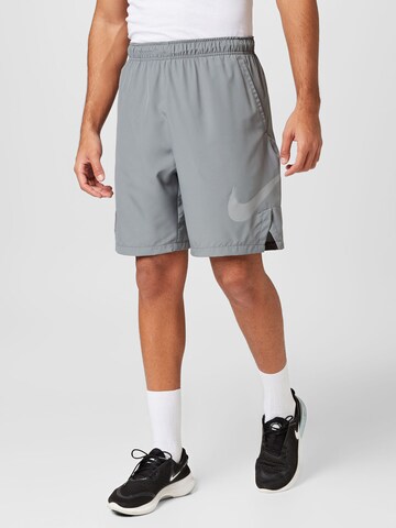 NIKE Loose fit Workout Pants in Grey: front