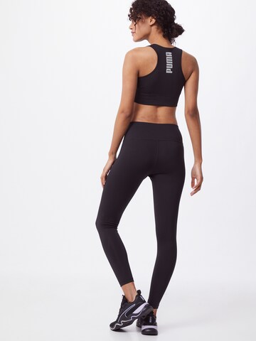 PUMA Skinny Sportbroek in Zwart