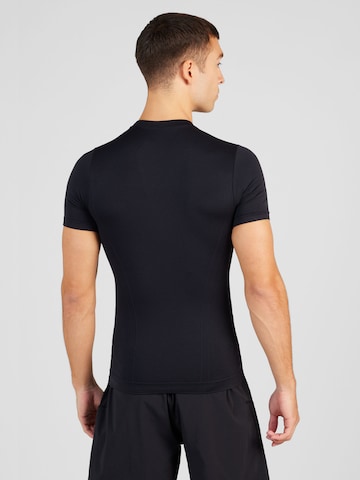 Champion Authentic Athletic Apparel - Camiseta funcional en negro