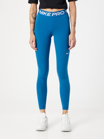 NIKE Skinny Workout Pants in Blue: front