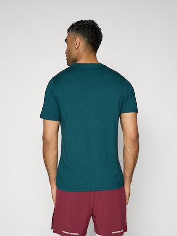 PUMA T-shirt 'Ess No. 1' i grön