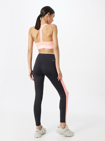 new balance Skinny Spodnie sportowe 'Accelerate' w kolorze czarny