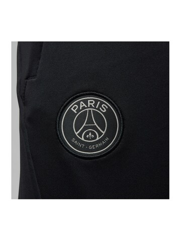 NIKE Slim fit Weatherproof pants in Black