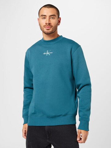 Sweat-shirt Calvin Klein Jeans en bleu : devant