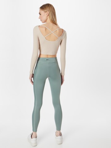 Skinny Pantaloni sportivi di Reebok in verde