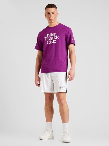 NIKE Sportshirt 'Track Club' in Lila