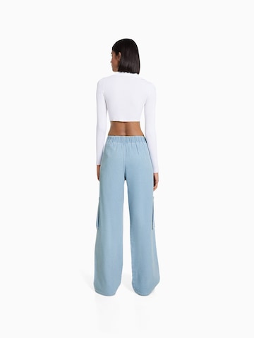 Bershka Wide leg Pressveckade jeans i blå