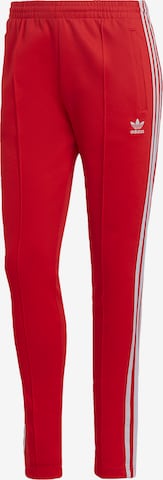 ADIDAS ORIGINALS Slim fit Pants in Red: front
