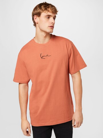 T-Shirt Karl Kani en orange : devant