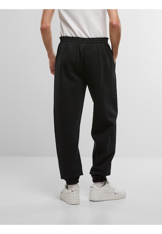Loosefit Pantalon de sport ' ' Karl Kani en noir