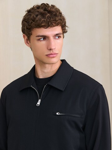 Next - Chaqueta de entretiempo 'Motionflex' en negro