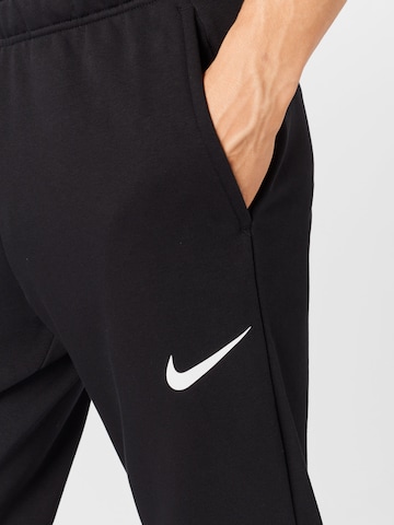 NIKE Zúžený Sportovní kalhoty – černá