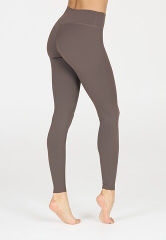 Athlecia Skinny Sportbroek 'Luxe' in Bruin
