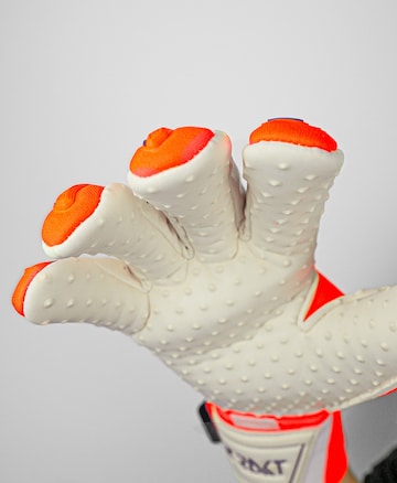 REUSCH Athletic Gloves 'Attrakt Freegel SpeedBump' in Orange