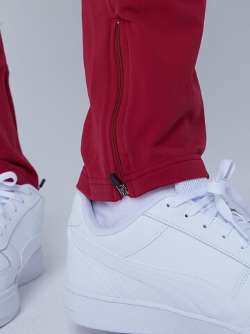 Coupe slim Pantalon de sport 'Slim Training Pants' SPORTKIND en rouge