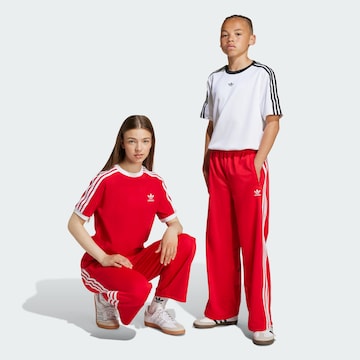 ADIDAS ORIGINALS Loose fit Trousers 'Adicolor Firebird' in Red: front